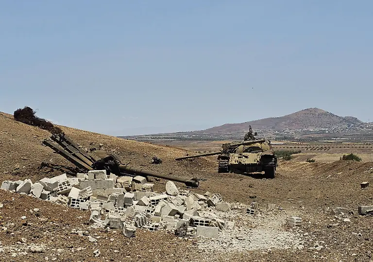 Israeli-artillery-shelling-targets-Daraa-s-Yarmouk-area-in-southern-Syria-DARAA-SYRIA-JUNE-04-A-view-of-damaged-Syrian-army-tanks-and-other-heavy-weapons-is-seen-in-the-Yarmouk-area-after-Israeli-artillery-fire-hit-the-area-in-response-to-rockets-allegedly-launched-into-Daraa-Syria-on-June-04-2025-Israeli-forces-conducted-artillery-shelling-on-the-Yarmouk-Basin-area-in-Daraa-province-in-southern-Syria-late-Tuesday-following-claims-that-two-rockets-were-fired-from-the-area-toward-the-Golan-Heights-the-Syrian-state-news-agency-SANA-reported-The-Israeli-Broadcasting-Authority-KAN-said-earlier-that-two-rockets-were-launched-from-Daraa-which-landed-in-an-open-area-in-the-Golan-Heights-The-projectiles-origin-remains-unclear