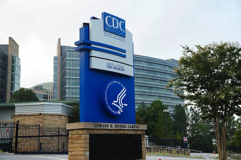 The-logo-of-Center-of-Disease-Control-and-Prevention-CDC-is-seen-as-the-glass-of-it-s-building-in-the-background-is-pockmarked-by-bullet-holes-following-a-deadly-shooting-incident-in-Atlanta-Georgia-U-S-August-9-2025