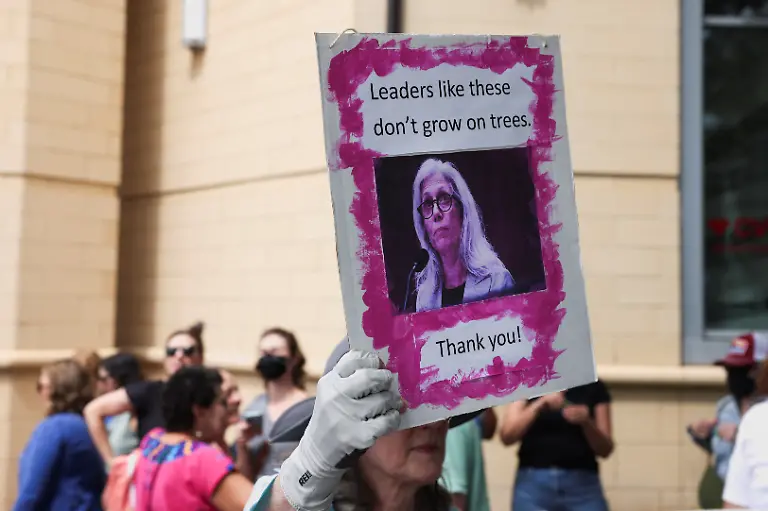 A-woman-holds-up-a-sign-with-an-image-of-former-Centers-for-Disease-Control-and-Prevention-CDC-director-Susan-Monarez-a-day-after-the-White-House-fired-Monarez-and-several-top-officials-resigned-in-Atlanta-Georgia-U-S-August-28-2025