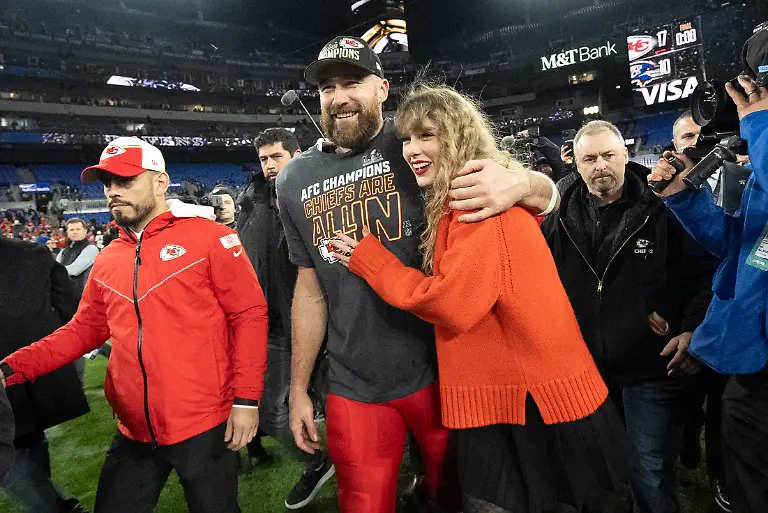 FILE-Kansas-City-Chiefs-tight-end-Travis-Kelce-and-Taylor-Swift-walk-together-after-an-AFC-Championship-NFL-football-game-between-the-Chiefs-and-the-Baltimore-Ravens-Jan-28-2024-in-Baltimore