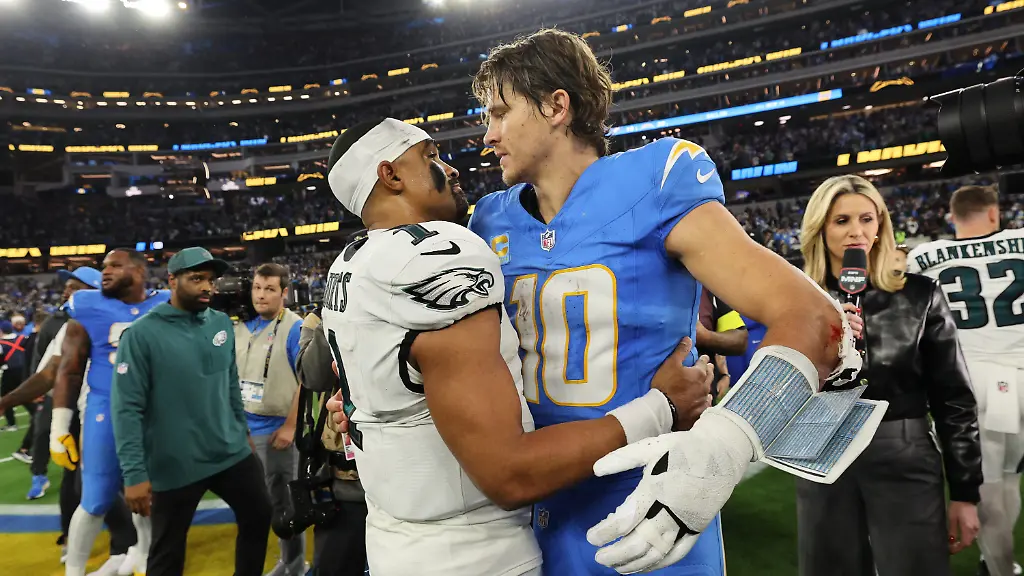 Los-Angeles-Chargers-quarterback-Justin-Herbert-10-hugs-Philadelphia-Eagles-quarterback-Jalen-Hurts-1-after-an-NFL-football-game-Monday-Dec-8-2025-in-Inglewood-Calif