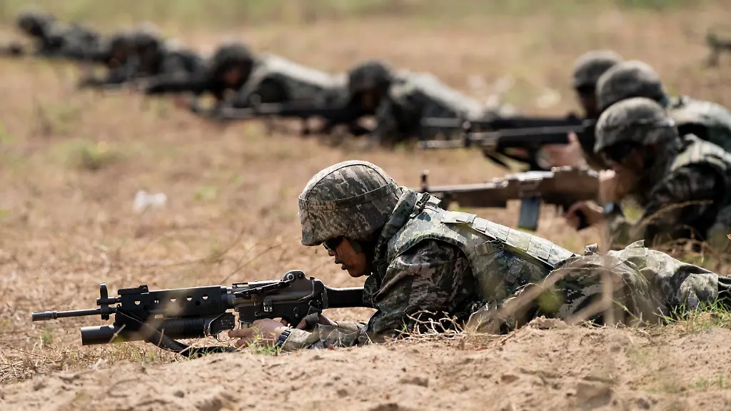 CHONBURI-THAILAND-MARCH-1-Soldiers-lay-in-the-field-with-their-guns-in-position-while-over-1500-military-personnel-representing-Thailand-the-United-States-of-America-and-South-Korea-participate-in-the-Amphibious-Exercise-as-a-part-of-Cobra-Gold-2024-at-Hat-Yao-Beach-in-Chonburi-Thailand-on-March-1-2024