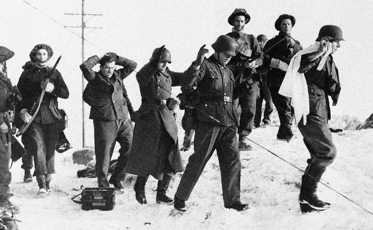 Germans-with-hands-upraised-who-surrendered-to-the-band-of-British-Commandos-who-carried-out-a-successful-raid-on-the-Norwegian-Islands-of-Vaagso-and-Malloy-on-Dec-27-1941-The-leader-carries-a-white-flag-of-surrender