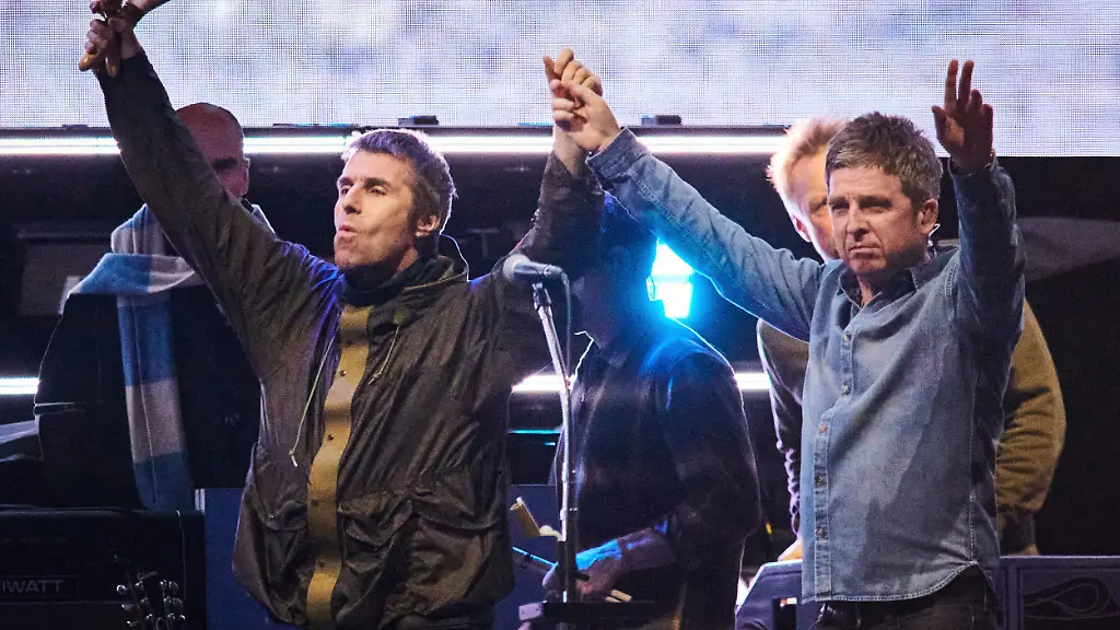 FILE-Liam-Gallagher-left-and-Noel-Gallagher-of-Oasis-walk-onstage-together-during-their-reunion-tour-in-Toronto-Sunday-Aug-24-2025