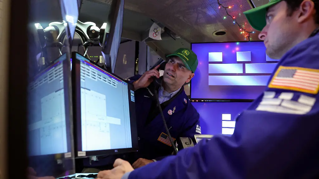 Traders-work-on-the-floor-at-the-New-York-Stock-Exchange-NYSE-in-New-York-City-U-S-December-8-2025
