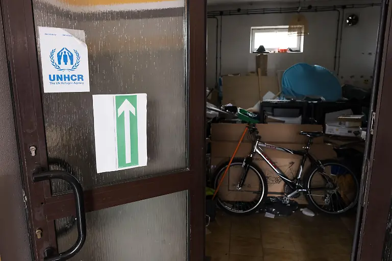 A-logo-of-United-Nations-High-Commissioner-for-Refugees-UNHCR-is-seen-in-the-shelter-The-Ukraine-Russia-conflict-is-progressing-and-stretching-into-its-fourth-year-compared-to-the-first-year-of-the-war-the-current-flood-of-refugees-has-been-shrinking-which-resulted-in-the-dropping-demand-of-the-refugee-shelters-in-Poland-near-the-Poland-Ukraine-border-Hope-Shelter-located-in-Przemy-l-and-founded-in-2022-remains-one-of-the-very-few-short-term-refuges-near-the-border-The-shelter-is-currently-operated-by-10-15-volunteers-with-no-paid-staff-they-work-nearly-12-hours-a-day-to-keep-providing-support-for-up-to-50-refugees-a-week-with-minimal-resources-Because-of-the-dropped-demand-in-refugee-support-the-fundings-and-aid-avaliable-to-the-shelter-have-significantly-decreased-With-the-increased-difficulties-to-access-new-grants-the-shelter-is-put-under-a-desperate-situation-against-the-shrinking-yet-ongoing-Ukrainian-refugee-crisis-According-to-the-volunteers-in-the-worst-case-scenario-the-operation-of-shelter-might-stop-in-September-which-is-unlikely-to-be-the-time-for-the-war-to-end