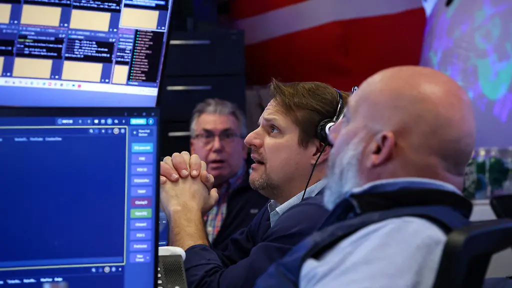 Traders-work-on-the-floor-at-the-New-York-Stock-Exchange-NYSE-in-New-York-City-U-S-December-10-2025