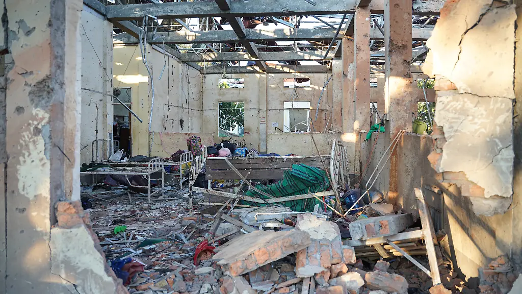 This-picture-shows-a-hospital-damaged-in-a-Myanmar-military-air-strike-that-killed-more-than-30-people-at-a-hospital-in-Mrauk-U-western-Rakhine-state-on-December-11-2025-A-Myanmar-military-air-strike-killed-more-than-30-people-at-a-hospital-an-on-site-aid-worker-said-on-December-11-2025-as-the-junta-wages-a-withering-offensive-ahead-of-elections-beginning-this-month-Photo-by-AFP-The-erroneous-mention-s-appearing-in-the-metadata-of-this-photo-by-STR-has-been-modified-in-AFP-systems-in-the-following-manner-a-hospital-damaged-instead-of-bodies-of-victims-Please-immediately-remove-the-erroneous-mention-s-from-all-your-online-services-and-delete-it-them-from-your-servers-If-you-have-been-authorized-by-AFP-to-distribute-it-them-to-third-parties-please-ensure-that-the-same-actions-are-carried-out-by-them-Failure-to-promptly-comply-with-these-instructions-will-entail-liability-on-your-part-for-any-continued-or-post-notification-usage-Therefore-we-thank-you-very-much-for-all-your-attention-and-prompt-action-We-are-sorry-for-the-inconvenience-this-notification-may-cause-and-remain-at-your-disposal-for-any-further-information-you-may-require