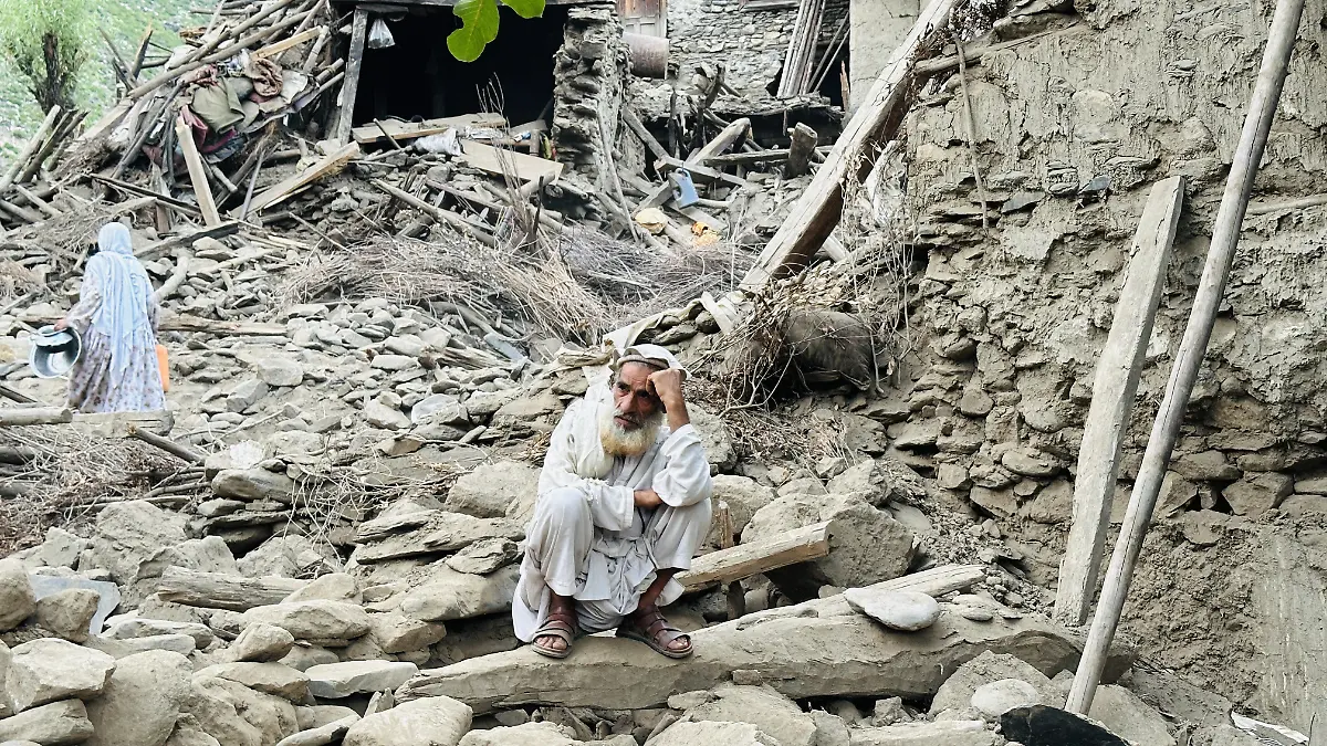 KUNAR-AFGHANISTAN-SEPTEMBER-02-A-man-is-seen-outside-near-severely-damaged-houses-after-a-6-0-magnitude-earthquake-struck-Afghanistan-s-eastern-Kunar-province-on-September-02-2025-The-quake-hit-central-Afghanistan-on-Sunday-killing-at-least-1-400-people-and-injuring-3-251-others-causing-much-devastation-in-the-eastern-provinces-of-Kunar-and-Nangarhar