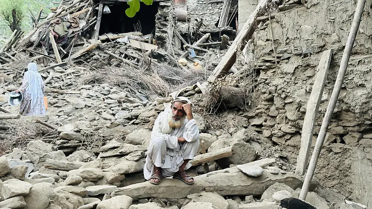 KUNAR-AFGHANISTAN-SEPTEMBER-02-A-man-is-seen-outside-near-severely-damaged-houses-after-a-6-0-magnitude-earthquake-struck-Afghanistan-s-eastern-Kunar-province-on-September-02-2025-The-quake-hit-central-Afghanistan-on-Sunday-killing-at-least-1-400-people-and-injuring-3-251-others-causing-much-devastation-in-the-eastern-provinces-of-Kunar-and-Nangarhar