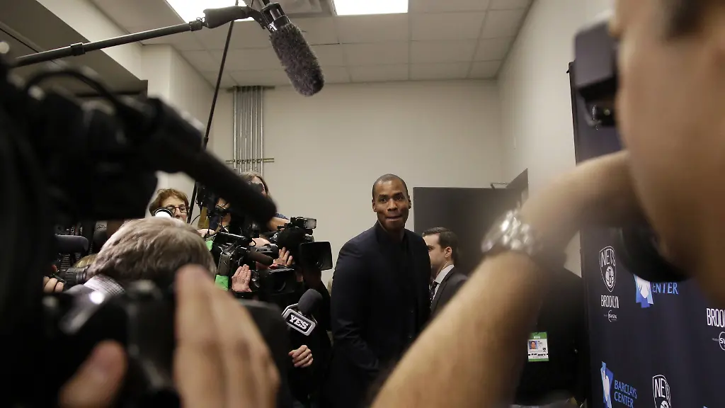 NBA-player-Jason-Collins-arrives-at-a-press-conference-before-the-Brooklyn-Nets-play-the-Milwaukee-Bucks-at-Barclays-Center-in-New-York-City-on-November-19-2014-Collins-who-became-the-first-openly-gay-athlete-in-North-America-s-four-recognized-major-team-sports-when-he-played-for-the-NBA-s-Brooklyn-Nets-last-season-announced-Wednesday-his-retirement-from-the-league