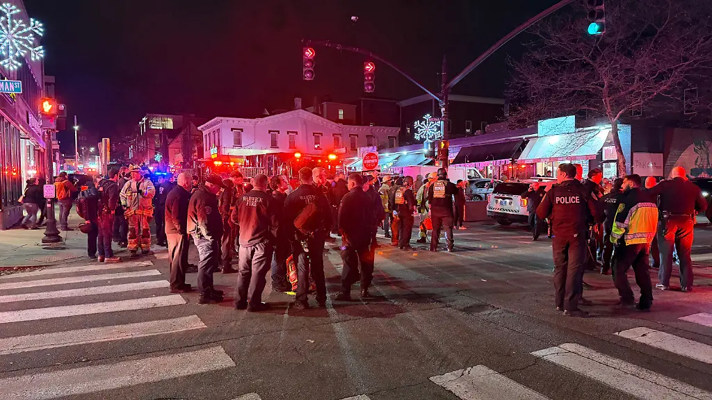 Police-officers-and-first-responders-gather-at-Waterman-St-and-Thayer-in-response-to-a-shooting-in-Providence-R-I-during-reports-of-a-shooting-Saturday-Dec-13-2025