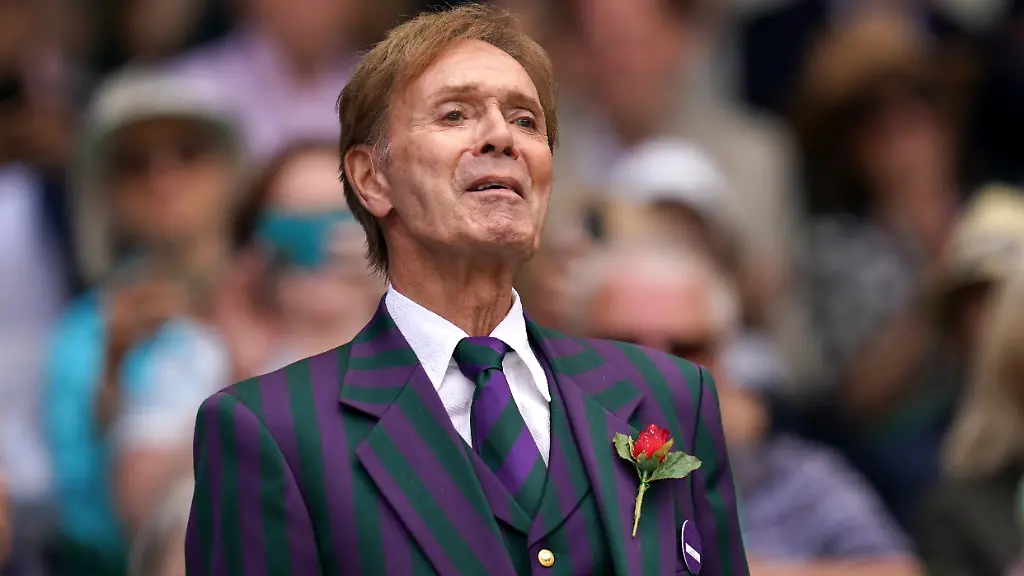 Wimbledon-2022-Day-Seven-All-England-Lawn-Tennis-and-Croquet-Club-Sir-Cliff-Richard-entertains-the-crowd-on-centre-court-during-day-seven-of-the-2022-Wimbledon-Championships-at-the-All-England-Lawn-Tennis-and-Croquet-Club-Wimbledon-Picture-date-Sunday-July-3-2022-See-PA-story-TENNIS-Wimbledon-Photo-credit-should-read-John-Walton-PA-Wire-Editorial-use-only-No-commercial-use-without-prior-written-consent-of-the-AELTC-Still-image-use-only-no-moving-images-to-emulate-broadcast-No-superimposing-or-removal-of-sponsor-ad-logos