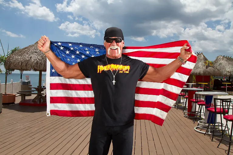 Legendary-wrestler-and-sports-icon-Terry-Bollea-better-known-as-Hulk-Hogan-poses-for-a-photo-at-his-restaurant-and-bar-Hogan-s-Beach-in-2014-Luis-Santana-Tampa-Bay-Times-TNS-ABACAPRESS