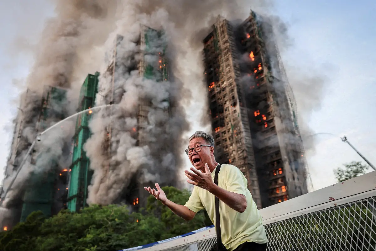 Wong-71-reacts-after-saying-his-wife-is-trapped-inside-Wang-Fuk-Court-during-a-major-fire-in-Tai-Po-Hong-Kong-China-November-26-2025-REUTERS-Tyrone-Siu-TPX-IMAGES-OF-THE-DAY-SEARCH-REUTERS-BEST-2025-FOR-THIS-STORY-SEARCH-REUTERS-2025-YEAR-END-FOR-ALL-2025-YEAR-END-GALLERIES