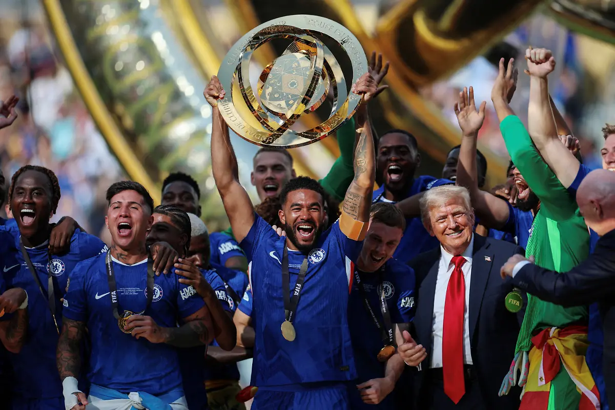 Soccer-Football-FIFA-Club-World-Cup-Final-Chelsea-v-Paris-St-Germain-MetLife-Stadium-East-Rutherford-New-Jersey-U-S-July-13-2025-Chelsea-s-Reece-James-lifts-the-trophy-as-he-celebrates-with-teammates-after-winning-the-FIFA-Club-World-Cup-as-President-Donald-Trump-reacts-REUTERS-Hannah-Mckay-TPX-IMAGES-OF-THE-DAY-SEARCH-REUTERS-BEST-SPORTS-2025-FOR-THIS-STORY-SEARCH-REUTERS-YEAR-END-FOR-ALL-2025-YEAR-END-GALLERIES