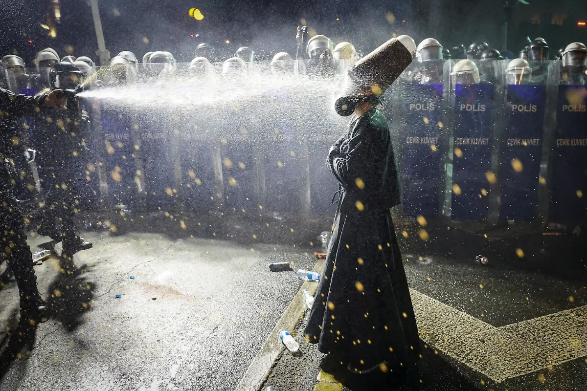 Police-officers-use-pepper-spray-on-a-demonstrator-wearing-dervish-clothes-during-a-protest-on-the-day-Istanbul-Mayor-Ekrem-Imamoglu-was-jailed-as-part-of-a-corruption-investigation-in-Istanbul-Turkey-March-23-2025-REUTERS-Umit-Bektas-TPX-IMAGES-OF-THE-DAY-SEARCH-REUTERS-BEST-2025-FOR-THIS-STORY-SEARCH-REUTERS-2025-YEAR-END-FOR-ALL-2025-YEAR-END-GALLERIES