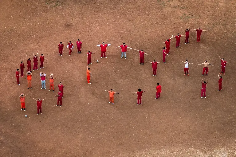 A-drone-view-of-detainees-forming-the-letters-SOS-with-their-bodies-in-the-courtyard-at-the-Bluebonnet-Detention-Facility-where-Venezuelans-facing-deportation-are-held-in-Anson-Texas-April-28