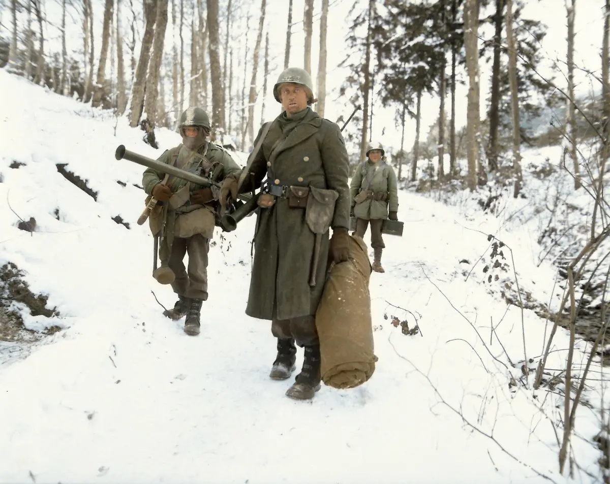 WWII-World-War-II-military-soldiers-army-Battle-of-the-Bulge-American-engineers-emerge-from-the-woods-and-move-out-of-defensive-positions-after-fighting-in-the-vicinity-of-Bastogne-Belgium-1944