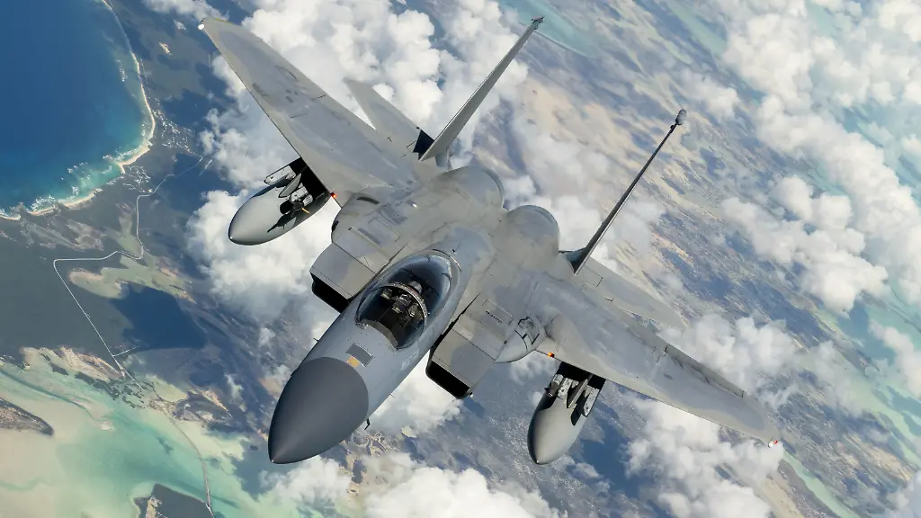 July-1-2022-Puerto-Rico-A-U-S-Air-Force-F-15C-Eagle-from-the-159th-Fighter-Wing-Louisiana-Air-National-Guard-Naval-Air-Station-Joint-Reserve-Base-New-Orleans-La-flies-in-formation-with-a-KC-135-Stratotanker-from-the-92nd-Air-Refueling-Wing-Fairchild-Air-Force-Base-Wash-upon-completion-of-North-American-Aerospace-Defense-Commandas-NORAD-Operation-Noble-Defender-OND-over-the-Caribbean-Sea-near-Puerto-Rico-July-1-2022-As-a-part-of-OND-which-is-a-recurring-operation-the-Continental-U-S-NORAD-Region-coordinated-and-conducted-joint-operations-with-the-U-S-Navy-while-concurrently-launching-jets-from-different-locations-across-the-USA-gulf-coast-and-Puerto-Rico-OND-is-an-integrated-air-and-missile-defense-operation-designed-to-ensure-the-defense-and-security-of-the-northern-and-southern-approaches-to-North-America-This-particular-OND-allowed-NORAD-units-to-exercise-maneuvers-designed-to-defend-the-southern-approach-to-the-USA-from-simulated-cruise-missile-threats-NORAD-is-a-bi-national-Canadian-and-American-command-that-employs-a-network-of-aerial-ground-based-and-space-based-sensors-air-to-air-refueling-tankers-and-fighter-aircraft-controlled-by-a-sophisticated-command-and-control-network-to-deter-detect-and-defend-against-aerial-threats-that-originate-outside-or-within-North-American-airspace-OND-is-an-integrated-air-and-missile-defense-operation-designed-to-ensure-the-defense-and-security-of-the-northern-and-southern-approaches-to-North-America-Credit-Image-U-S-Air-Force-ZUMA-Press-Wire-Service-ZUMAPRESS