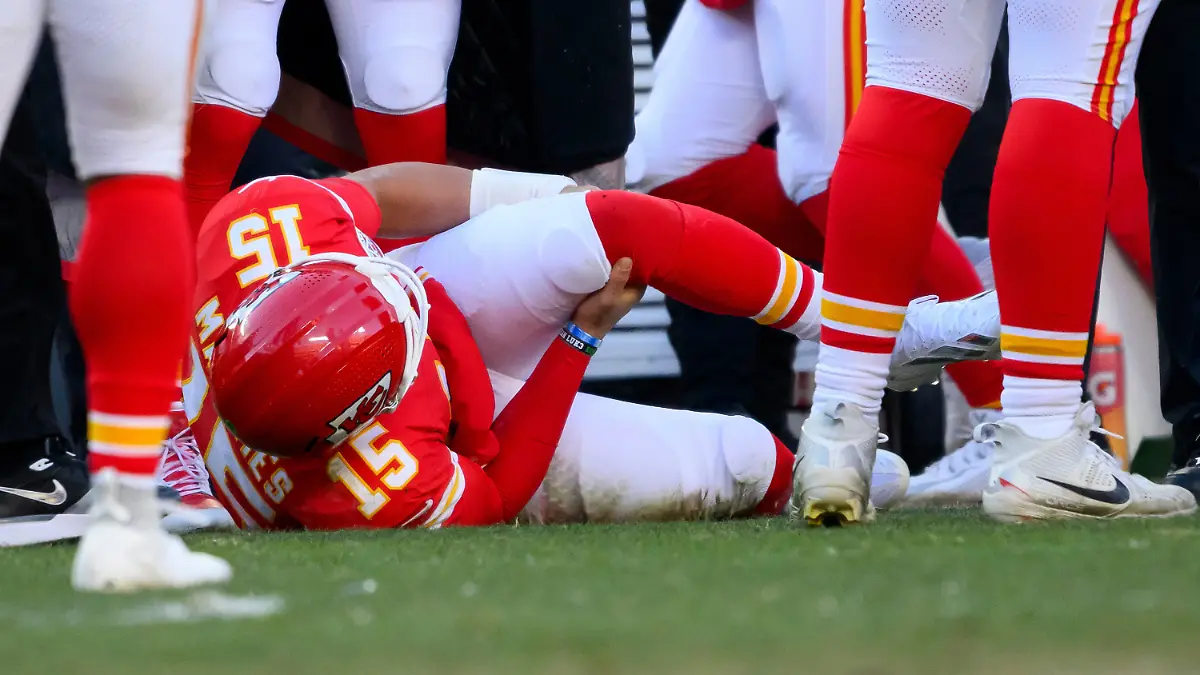 Kansas-City-Chiefs-quarterback-Patrick-Mahomes-grabs-his-knee-after-being-injured-during-the-second-half-of-an-NFL-football-game-against-the-Los-Angeles-Chargers-Sunday-Dec-14-2025-in-Kansas-City-Mo
