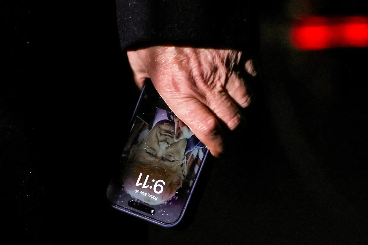 U-S-President-Donald-Trump-holds-a-mobile-phone-with-his-image-on-it-after-his-return-from-Pennsylvania-at-Joint-Base-Andrews-Maryland-U-S-May-30-2025-REUTERS-Leah-Millis-TPX-IMAGES-OF-THE-DAY-SEARCH-REUTERS-BEST-2025-FOR-THIS-STORY-SEARCH-REUTERS-2025-YEAR-END-FOR-ALL-2025-YEAR-END-GALLERIES