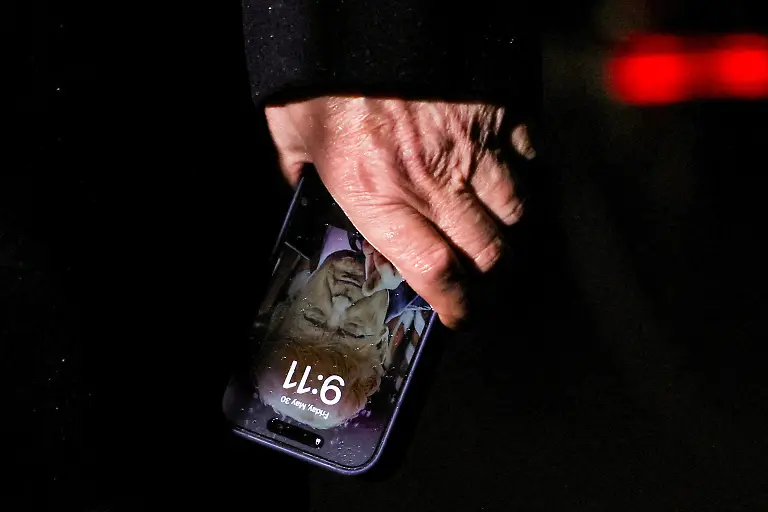 U-S-President-Donald-Trump-holds-a-mobile-phone-with-his-image-on-it-after-his-return-from-Pennsylvania-at-Joint-Base-Andrews-Maryland-U-S-May-30-2025-REUTERS-Leah-Millis-TPX-IMAGES-OF-THE-DAY-SEARCH-REUTERS-BEST-2025-FOR-THIS-STORY-SEARCH-REUTERS-2025-YEAR-END-FOR-ALL-2025-YEAR-END-GALLERIES