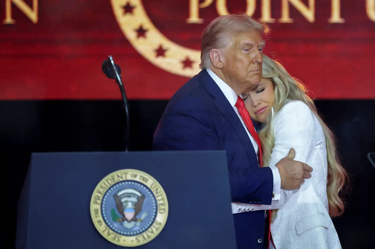 U-S-President-Donald-Trump-embraces-Erika-Kirk-during-a-memorial-service-for-her-husband-slain-conservative-commentator-Charlie-Kirk-at-State-Farm-Stadium-in-Arizona-U-S-September-21-2025-REUTERS-Carlos-Barria-TPX-IMAGES-OF-THE-DAY-SEARCH-REUTERS-BEST-2025-FOR-THIS-STORY-SEARCH-REUTERS-2025-YEAR-END-FOR-ALL-2025-YEAR-END-GALLERIES