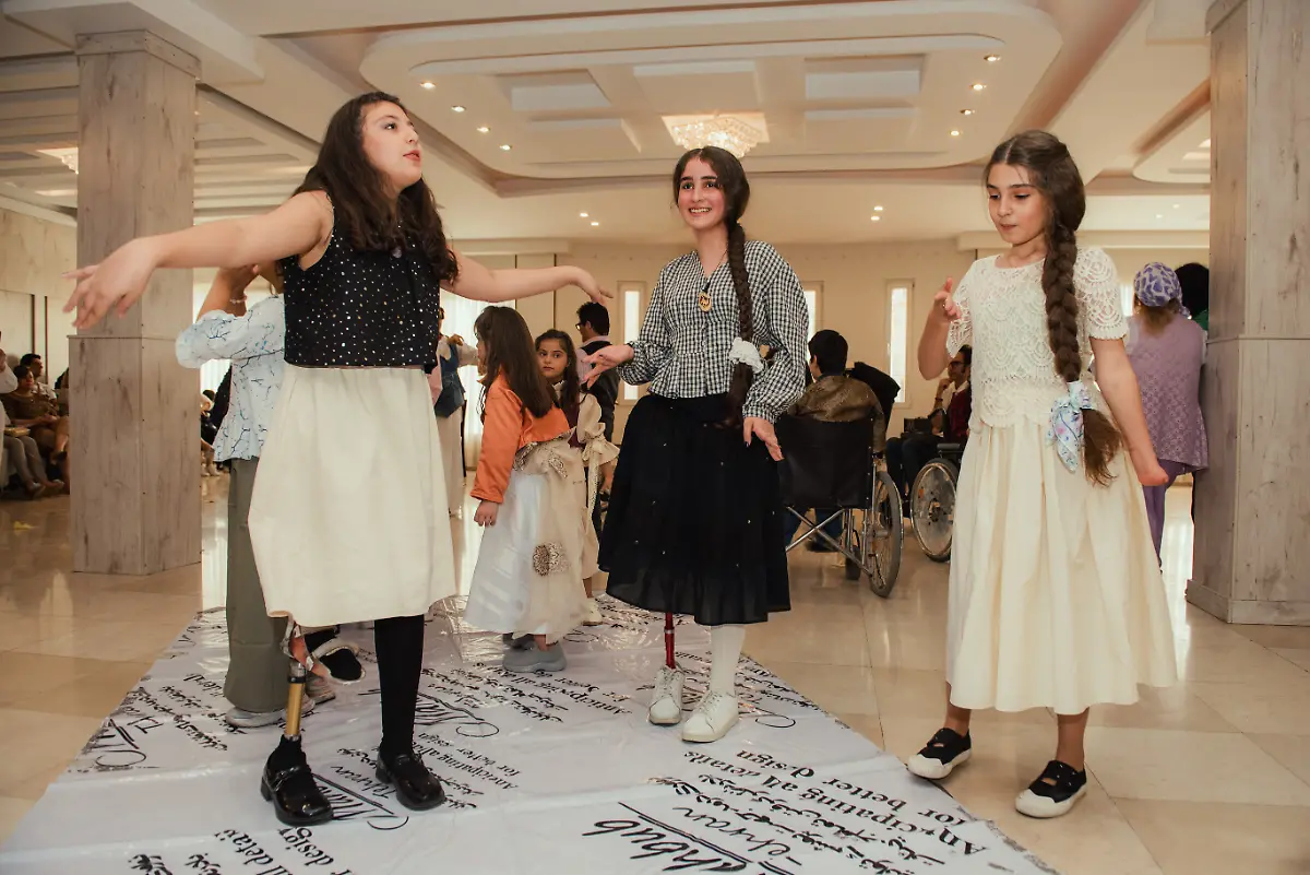 Children-and-young-participants-with-disabilities-take-part-in-a-catwalk-event-organized-by-the-Mahboob-Tehran-Institute-in-Tehran-Iran-on-September-9-2025-The-organization-led-by-Mahboubeh-Rahimian-works-to-support-people-with-disabilities-and-promote-social-inclusion-through-art-education-and-community-events
