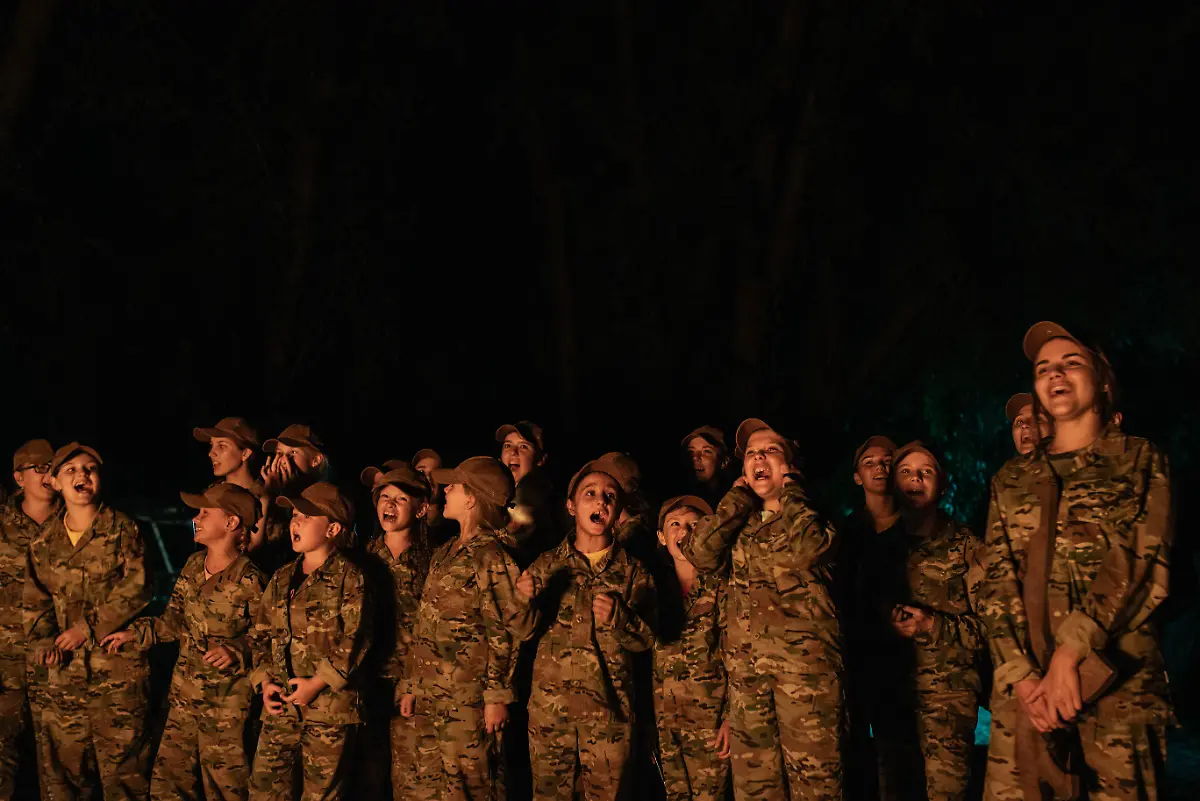 Kyiv-region-2018-Young-girls-singing-during-a-recreational-moment-at-the-summer-military-camp-organized-by-the-Azov-Battalion