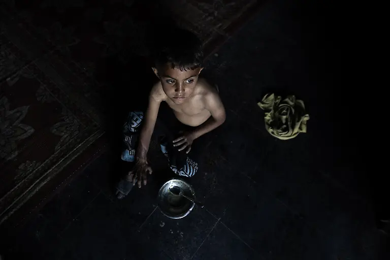 NYTCEASEFIRE-May-24-2025-Gaza-City-Abdullah-Ashour-7-years-old-Eats-lentil-soup-with-a-spoon-due-to-the-lack-of-bread-but-it-doesn-t-satisfy-his-hunger