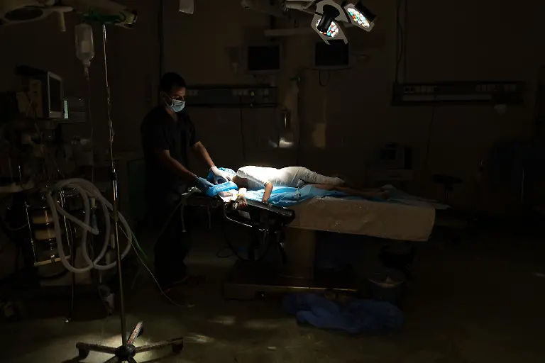 NYTCEASEFIRE-July-14-2025-Gaza-City-Medical-staff-work-inside-the-operating-room-at-Al-Quds-Hospital