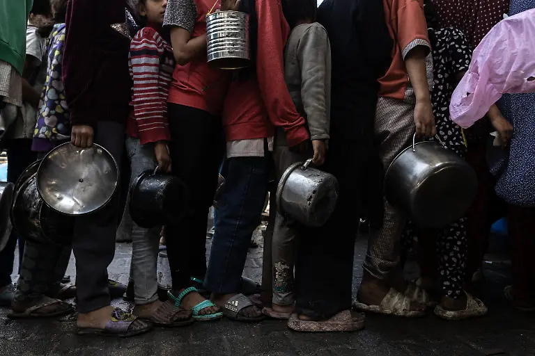 NYTCEASEFIRE-May-21-2025-Gaza-City-Adel-Adeeb-Sukkar-has-been-providing-free-meals-to-displaced-people-in-central-Gaza-City-since-the-beginning-of-the-war-with-support-from-the-Sukkar-family-abroad-His-grocery-store-feeds-500-families-daily-He-is-about-to-close-in-two-days-due-to-depletion-of-his-stock