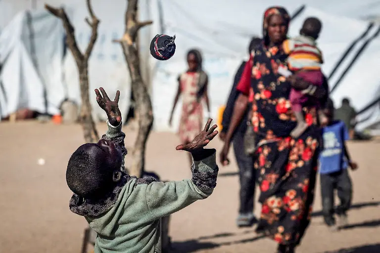 Mousa-Bakr-8-a-Sudanese-refugee-from-al-Fashir-plays-with-a-handmade-sock-ball-because-he-has-no-access-to-a-real-football-at-the-Tine-transit-refugee-camp-in-eastern-Chad-amid-the-ongoing-conflict-between-the-paramilitary-Rapid-Support-Forces-RSF-and-the-Sudanese-army-November-23-2025-REUTERS-Amr-Abdallah-Dalsh-TPX-IMAGES-OF-THE-DAY-SEARCH-REUTERS-BEST-2025-FOR-THIS-STORY-SEARCH-REUTERS-2025-YEAR-END-FOR-ALL-2025-YEAR-END-GALLERIES