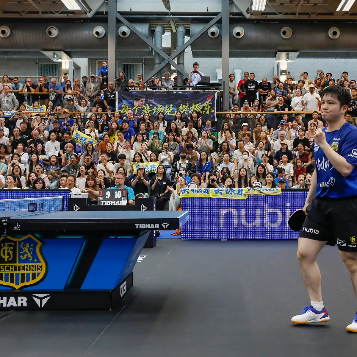 250901-SAARBRUECKEN-Sept-1-2025-Xinhua-Fan-Zhendong-of-1-FC-Saarbruecken-TT-reacts-while-competing-against-Romain-Ruiz-of-TTC-Schwalbe-Bergneustadt-during-the-Table-Tennis-Bundesliga-TTBL-first-round-match-between-1-FC-Saarbruecken-TT-and-TTC-Schwalbe-Bergneustadt-in-Saarbruecken-Germany-Aug-31-2025
