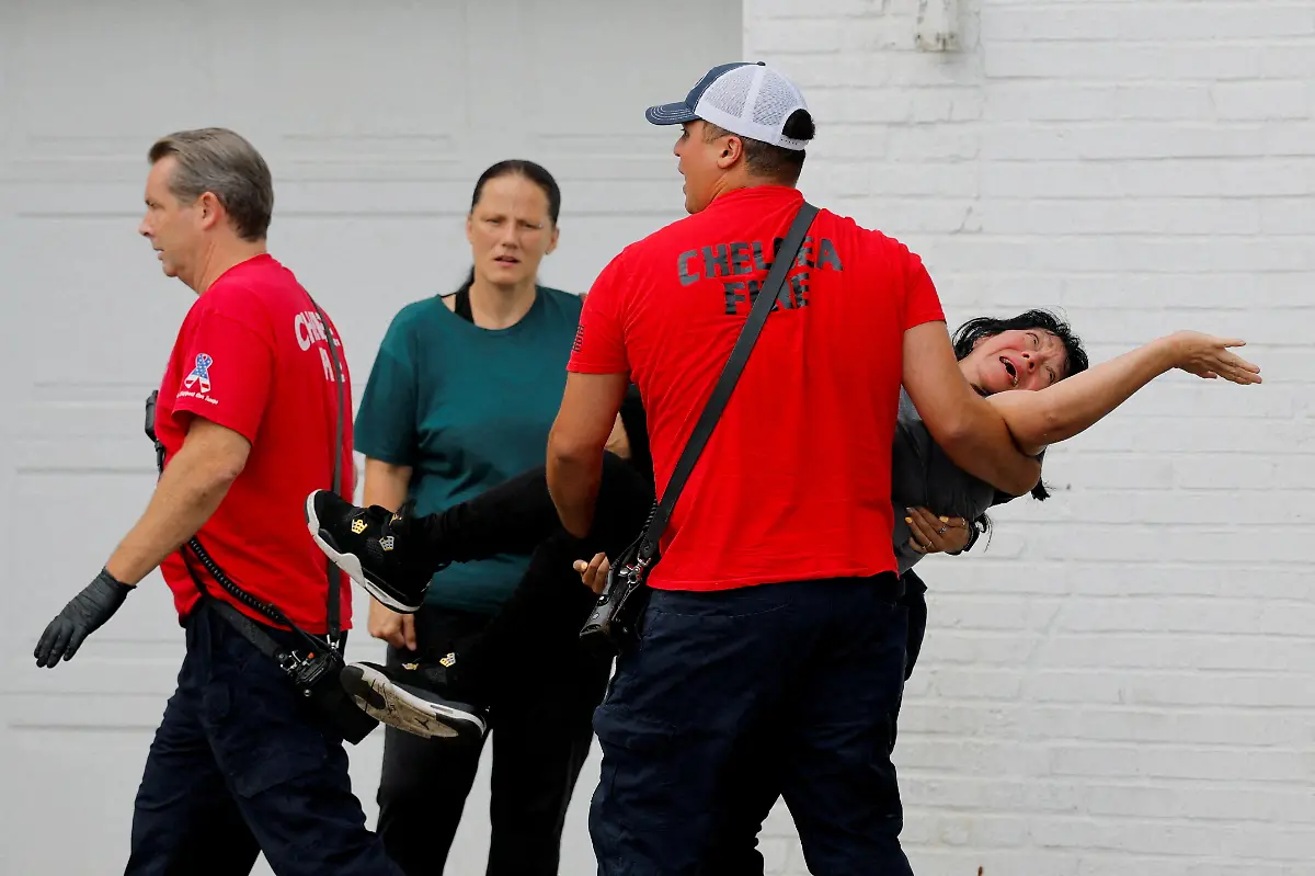 A-woman-is-taken-to-an-ambulance-after-being-detained-by-federal-agents-including-U-S-Marshals-FBI-agents-and-HSI-agents-during-an-immigration-enforcement-raid-in-Chelsea-Massachusetts-September-26-The-agents-reportedly-released-the-woman-at-the-scene-because-she-is-a-legal-U-S-resident