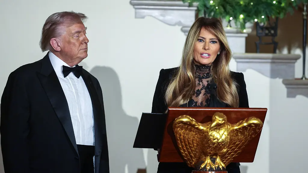 United-States-President-Donald-J-Trump-left-and-first-lady-Melania-Trump-right-make-remarks-as-they-attend-the-Congressional-Ball-in-the-Grand-Foyer-of-the-White-House-in-Washington-DC-USA-11-December-2025