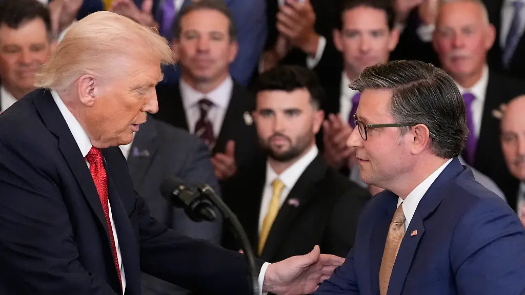 President-Donald-Trump-shakes-hands-with-House-Speaker-Mike-Johnson-of-La-during-an-event-to-welcome-the-2025-LSU-and-LSU-Shreveport-national-champion-baseball-teams-in-the-East-Room-of-the-White-House-Monday-Oct-20-2025-in-Washington