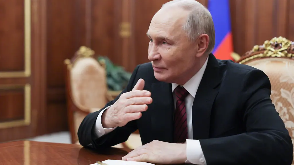 Russian-President-Vladimir-Putin-speaks-with-Chairman-of-the-Constitutional-Court-Valery-Zorkin-during-their-meeting-at-the-Kremlin-in-Moscow-Russia-Thursday-Dec-11-2025