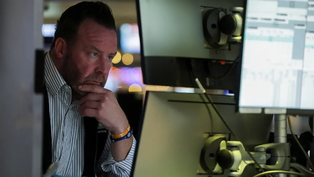 A-trader-works-on-the-floor-at-the-New-York-Stock-Exchange-NYSE-in-New-York-City-U-S-December-11-2025