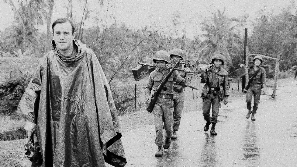 Associated-Press-correspondent-Peter-Arnett-left-marches-in-column-with-Vietnamese-troops-as-he-covers-the-war-in-Vietnam-Nov-11-1965-The-conflict-is-described-as-one-of-the-most-difficult-and-dangerous-for-those-who-cover-it-because-of-the-way-it-is-fought-There-are-no-front-lines-or-clearly-marked-friendly-or-enemy-territories