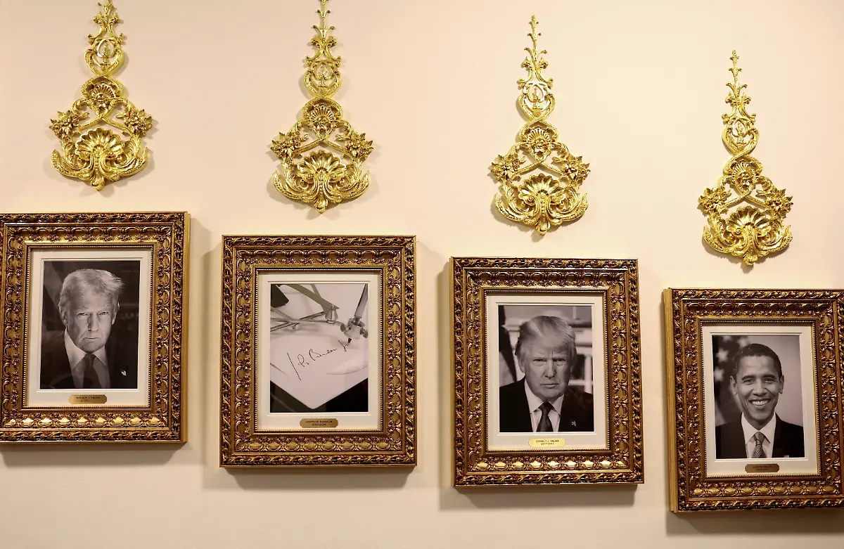 An-image-of-an-autopen-signing-former-U-S-President-Joe-Biden-s-signature-is-displayed-in-place-of-a-portrait-of-Biden-next-to-portraits-of-U-S-President-Donald-Trump-and-President-Barack-Obama-at-the-Presidential-Walk-of-Fame-along-the-Colonnade-at-the-White-House-in-Washington-D-C-U-S-October-2-2025