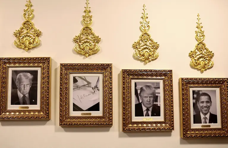 An-image-of-an-autopen-signing-former-U-S-President-Joe-Biden-s-signature-is-displayed-in-place-of-a-portrait-of-Biden-next-to-portraits-of-U-S-President-Donald-Trump-and-President-Barack-Obama-at-the-Presidential-Walk-of-Fame-along-the-Colonnade-at-the-White-House-in-Washington-D-C-U-S-October-2-2025