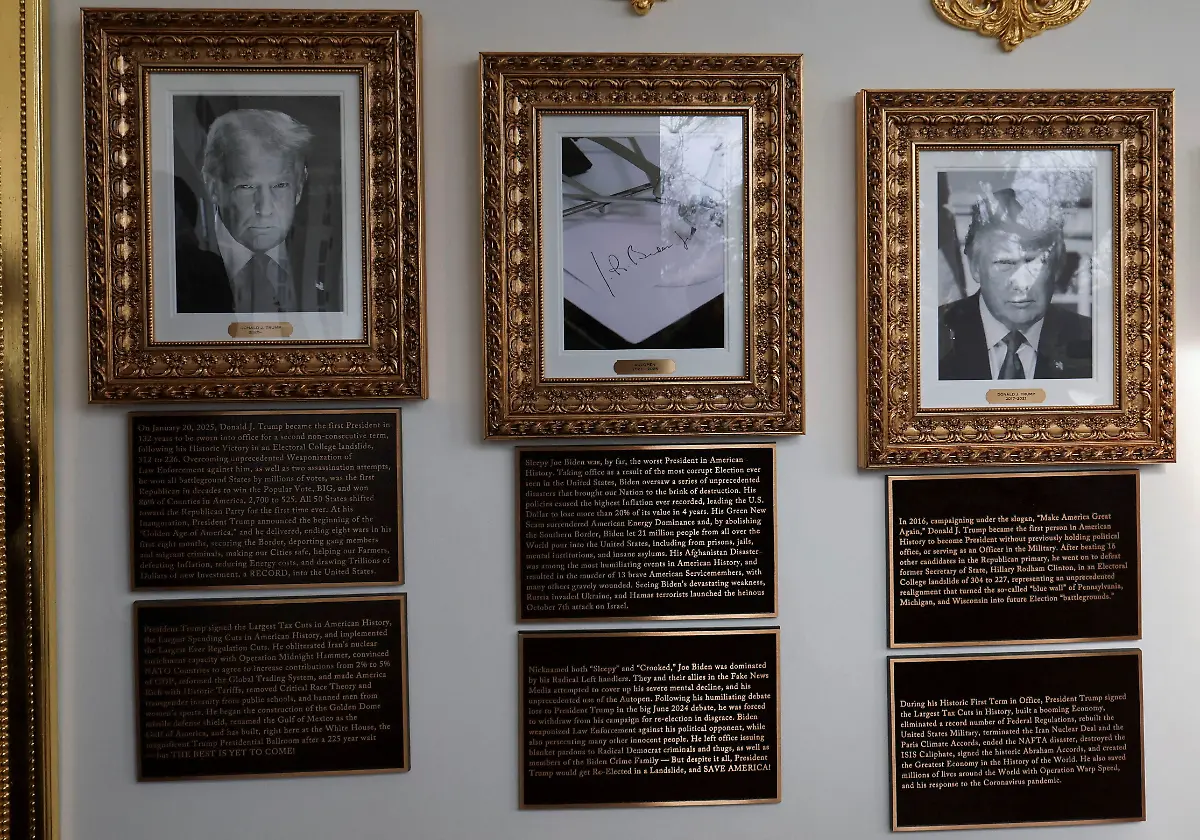 Portraits-of-U-S-President-Donald-Trump-flank-an-image-of-an-autopen-signing-former-U-S-President-Joe-Biden-s-signature-in-place-of-a-portrait-of-Biden-on-the-Presidential-Walk-of-Fame-along-the-White-House-Colonnade-in-Washington-D-C-U-S-December-17-2025