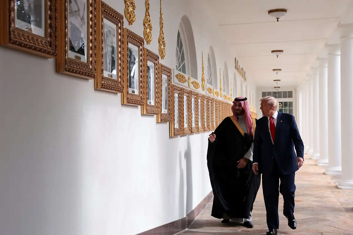 U-S-President-Donald-Trump-and-Saudi-Crown-Prince-and-Prime-Minister-Mohammed-bin-Salman-look-at-portraits-at-the-Presidential-Walk-of-Fame-in-the-Colonnade-at-the-White-House-in-Washington-D-C-U-S-November-18-2025