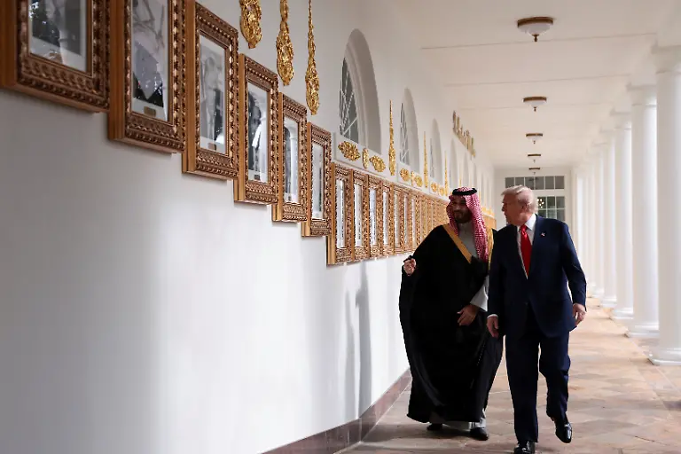 U-S-President-Donald-Trump-and-Saudi-Crown-Prince-and-Prime-Minister-Mohammed-bin-Salman-look-at-portraits-at-the-Presidential-Walk-of-Fame-in-the-Colonnade-at-the-White-House-in-Washington-D-C-U-S-November-18-2025