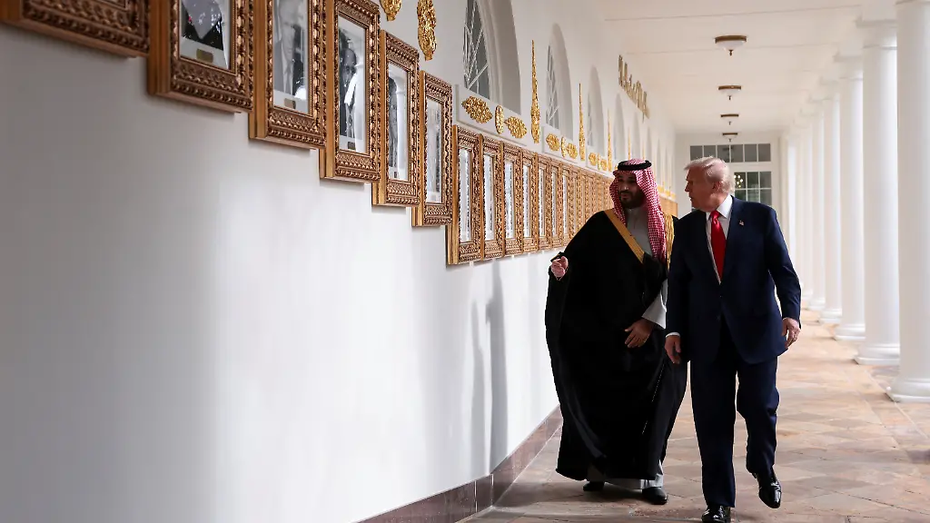 U-S-President-Donald-Trump-and-Saudi-Crown-Prince-and-Prime-Minister-Mohammed-bin-Salman-look-at-portraits-at-the-Presidential-Walk-of-Fame-in-the-Colonnade-at-the-White-House-in-Washington-D-C-U-S-November-18-2025