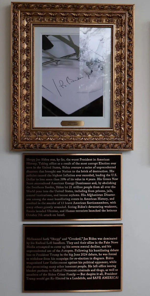 An-image-of-an-autopen-signing-former-U-S-President-Joe-Biden-s-signature-is-displayed-in-place-of-a-portrait-of-Biden-on-the-Presidential-Walk-of-Fame-along-the-White-House-Colonnade-in-Washington-D-C-U-S-December-17-2025