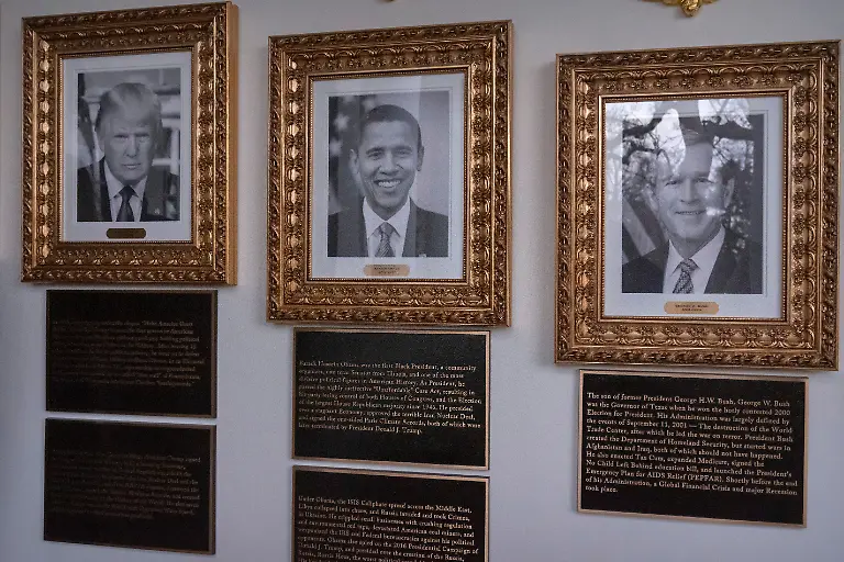 Portraits-of-President-Donald-Trump-and-former-Presidents-Barack-Obama-and-George-W-Bush-with-plaques-of-text-below-are-seen-on-the-Presidential-Walk-of-Fame-on-the-Colonnade-of-the-White-House-Wednesday-Dec-17-2025-in-Washington