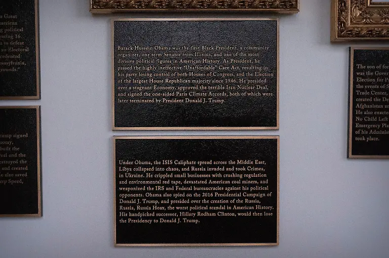 Plaques-of-explanatory-text-are-seen-beneath-a-framed-portrait-of-former-President-Barack-Obama-on-the-Presidential-Walk-of-Fame-on-the-Colonnade-of-the-White-House-Wednesday-Dec-17-2025-in-Washington